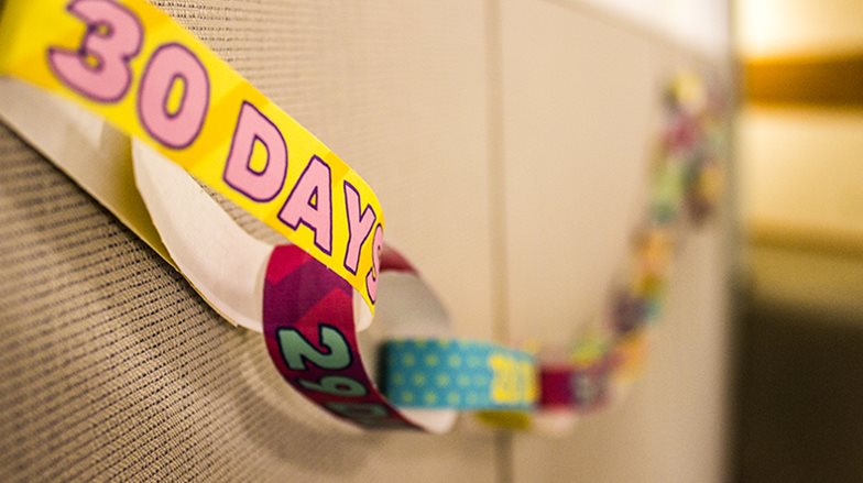 Countdown Chain Hanging on Fabric Bulletin Board Wall